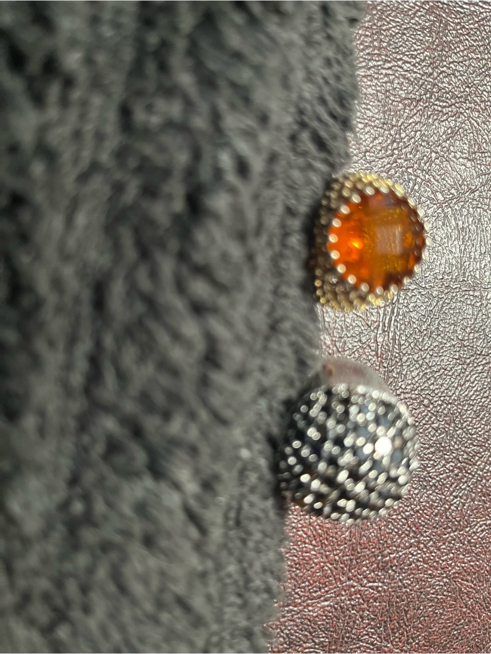 Orange stone in beautiful raised gold tone,also black shiny stones/silver tone